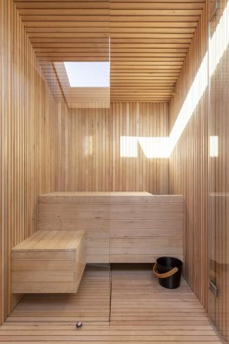 a sauna with a bench in a wooden room at Radar by Bloom Stays in Littlestone-on-Sea