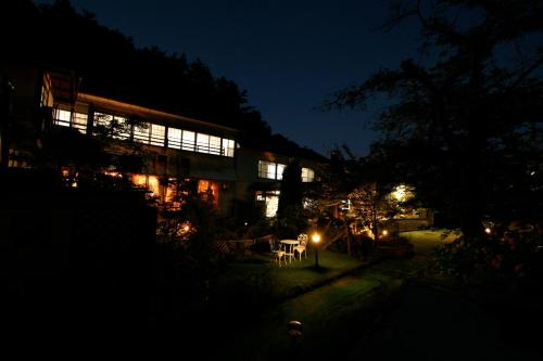a building lit up at night with lights at Shosenkaku in Nagano
