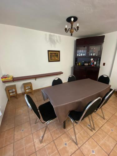 a dining room with a table and chairs in a room at Pura Vida! Ciudad Hidalgo in Ciudad Hidalgo