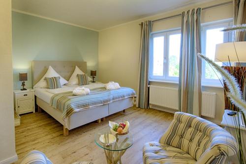 Katil atau katil-katil dalam bilik di Das Frühstückshotel Sankt Peter-Ording