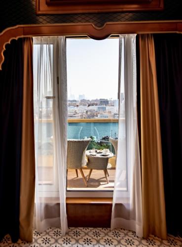 a window with a view of a balcony at Riviera Hotel in Dubai