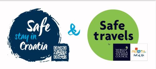 two stickers with the words safe travels and stay in croatia at Hotel Villa Diana in Split