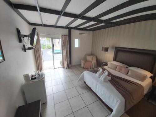 Letto o letti in una camera di Rockview Lodge