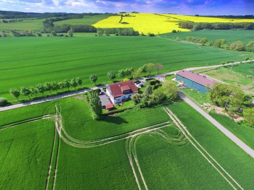 an aerial view of a house in the middle of a field at Ferienwohnungen Kleckerburg mit Me in Kägsdorf