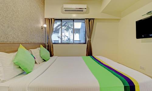 Cama o camas de una habitación en Treebo Vikrant Residency