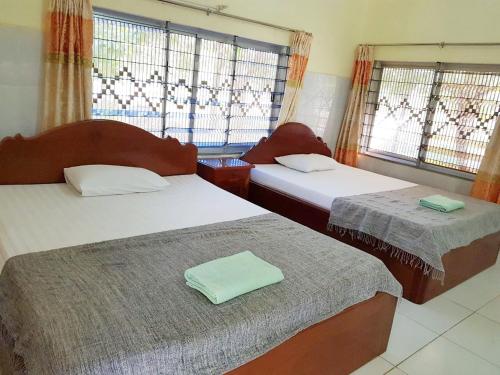 
A bed or beds in a room at Meas Family Homestay
