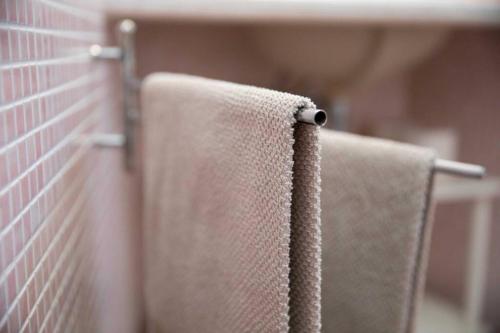 a towel hanging on the back of a chair at La Casetta - Casa Indipendente nel centro storico in Fermo