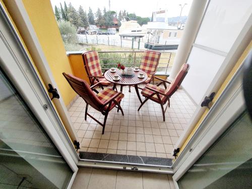 a patio with a table and chairs on a balcony at Apartment Bonaca in Portorož