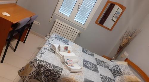 a table in a room with a table cloth on it at Hostal Monteclaro in Ponferrada