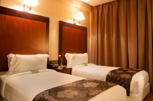 Tempat tidur dalam kamar di Park Avenue Hotel Nungambakkam