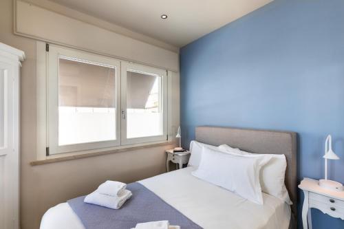 Letto o letti in una camera di Viareggio Suite - Sea view apartment