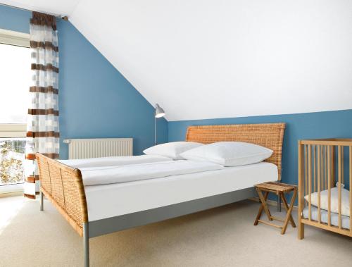 Postel nebo postele na pokoji v ubytování Ferienhaus Kaltenhofer Strandmuschel