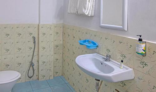 a bathroom with a sink and a toilet at Treebo Omega Stay Inn in Shillong