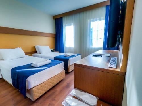 Postel nebo postele na pokoji v ubytování Afytos Bodrum City