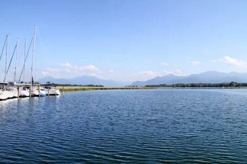two boats are docked in a large body of water at Hotel Aiterbach am Chiemsee in Rimsting