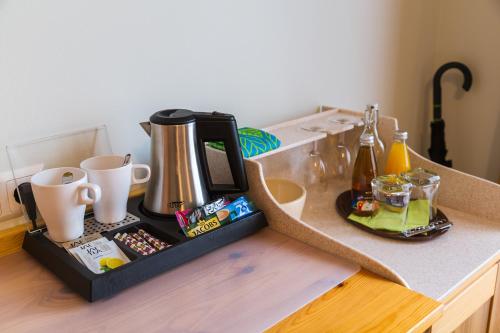 a coffee maker on top of a counter at Penzion Kaps in Bled