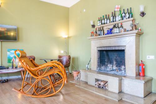 a living room with a chair and a fireplace at Pushkin 10 Hostel in Tbilisi City