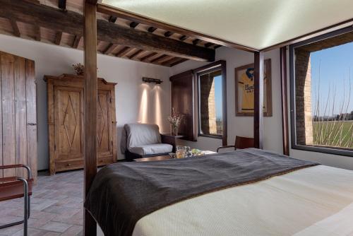 En eller flere senge i et værelse på Bosco Della Spina