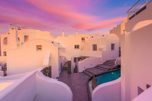 a view of a house with a swimming pool at Sole d'oro Luxury Suites in Oia