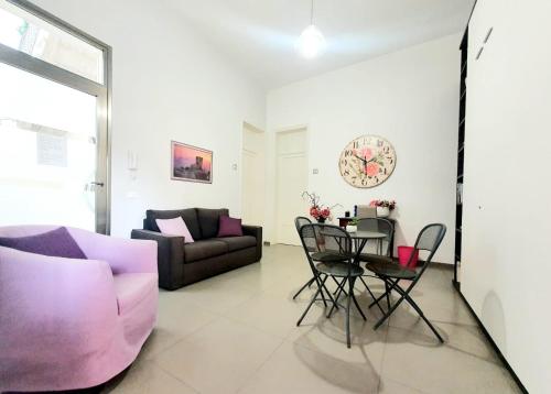a living room with a couch and a table at Terrazze Villanova in Trapani