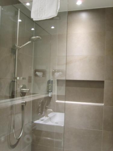 a bathroom with a shower and a sink at Hotel Schnookeloch in Heidelberg