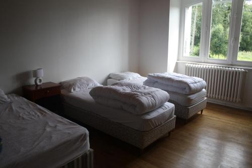 Postel nebo postele na pokoji v ubytování Gîte du courtil aux fées