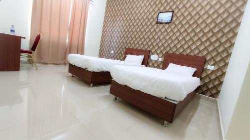 Ένα ή περισσότερα κρεβάτια σε δωμάτιο στο Fortune Village Hotel