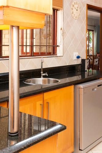 a kitchen with a sink and a counter top at Sea Forever in Pennington