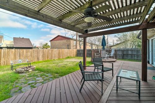 a patio with two chairs and a ceiling fan at Bright College Station Abode 3 Mi to Kyle Field in Bryan