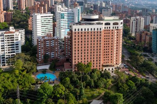 an overhead view of a large building in a city at Hotel Dann Carlton Medellín in Medellín