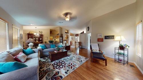 a living room with a couch and a table at 120 Winding Meadow by Vacation Rentals for You in Monument