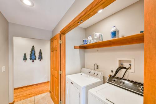 a laundry room with a washer and dryer at Tall Pines in Swanton