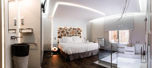 En eller flere senger på et rom på Mirador del Alba