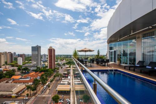 a view from the balcony of a building with a swimming pool at Viale Tower Hotel in Foz do Iguaçu