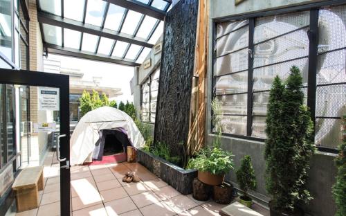 a tent is set up inside of a building at Skwachàys Lodge in Vancouver