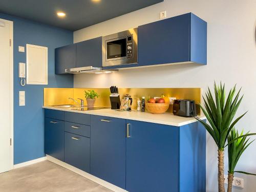 Η κουζίνα ή μικρή κουζίνα στο Astoria Apartments