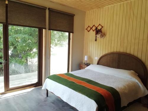 A bed or beds in a room at QUELEN PATAGONIA