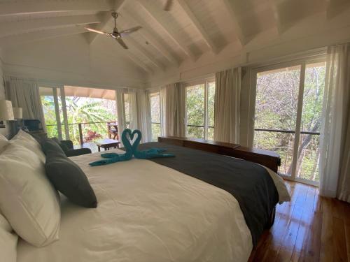 a bedroom with a large bed with an octopus on it at Mikado Natural Lodge in Playa Avellana