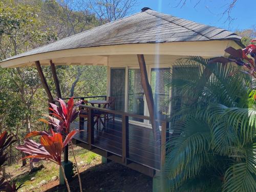 a gazebo in the middle of a forest at Mikado Natural Lodge in Playa Avellana