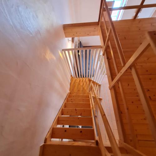 a wooden staircase leading up to the top of a building at Alba Odeceixe - casa alta in Odeceixe