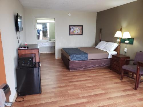 Ένα ή περισσότερα κρεβάτια σε δωμάτιο στο Mountain Home Inn