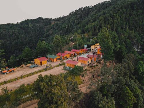 an aerial view of a group of buildings on a mountain at Cabañas Rancho Viejo in El Pacífico