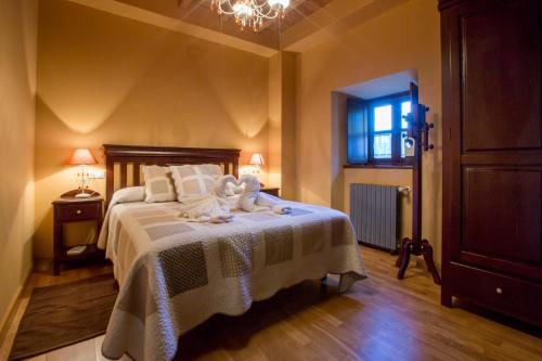 Ένα ή περισσότερα κρεβάτια σε δωμάτιο στο La Casona de Amaido