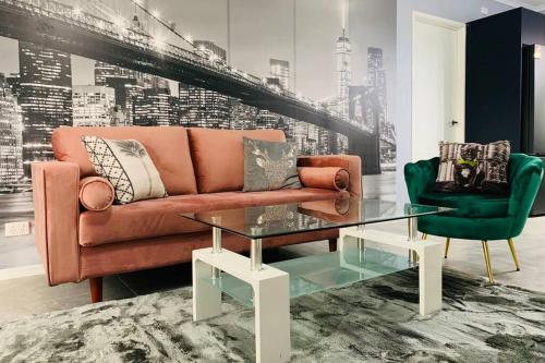 a living room with a couch and a table at Southbank Modern Luxe Apartment in Brisbane