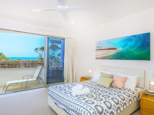 a bedroom with a bed and a view of the ocean at Azura Ocean View Holiday Apartment in Kingscliff