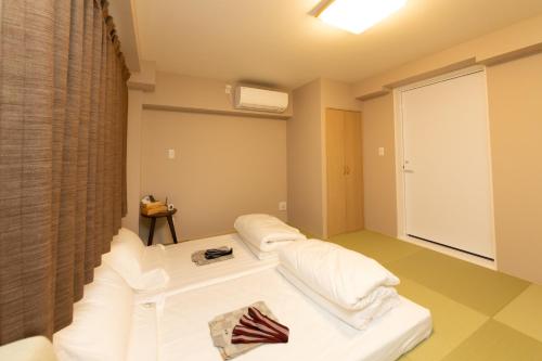 灯光旅館 Light hotelにあるベッド