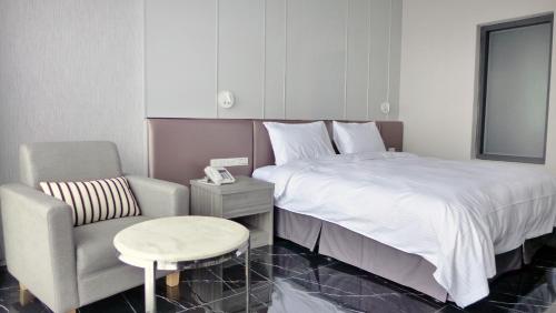 Postel nebo postele na pokoji v ubytování Champ De Rose Hotel