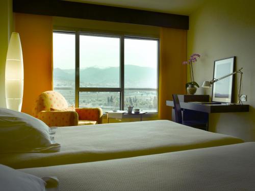 Posteľ alebo postele v izbe v ubytovaní Hotel Abades Nevada Palace