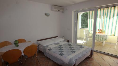 Apartments Grahovac tesisinde bir odada yatak veya yataklar