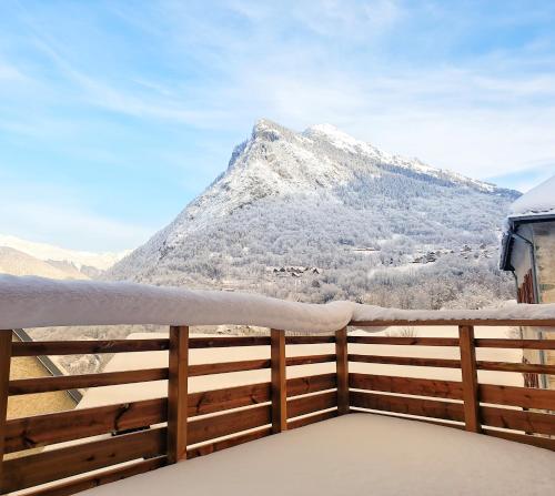 a view of a snow covered mountain from a balcony at Chalet 800 in Oz